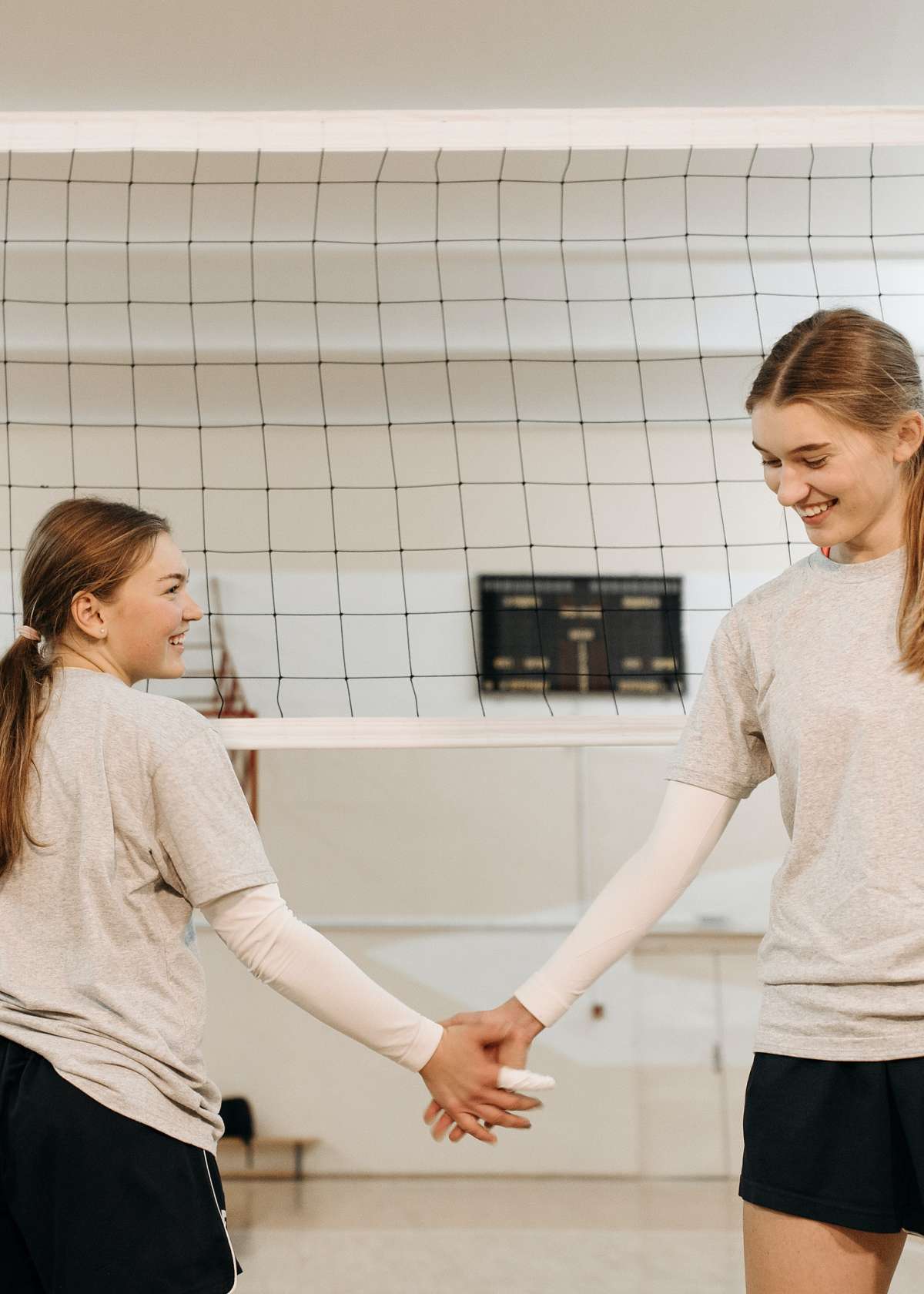 Female volleyball players with arm sleeves