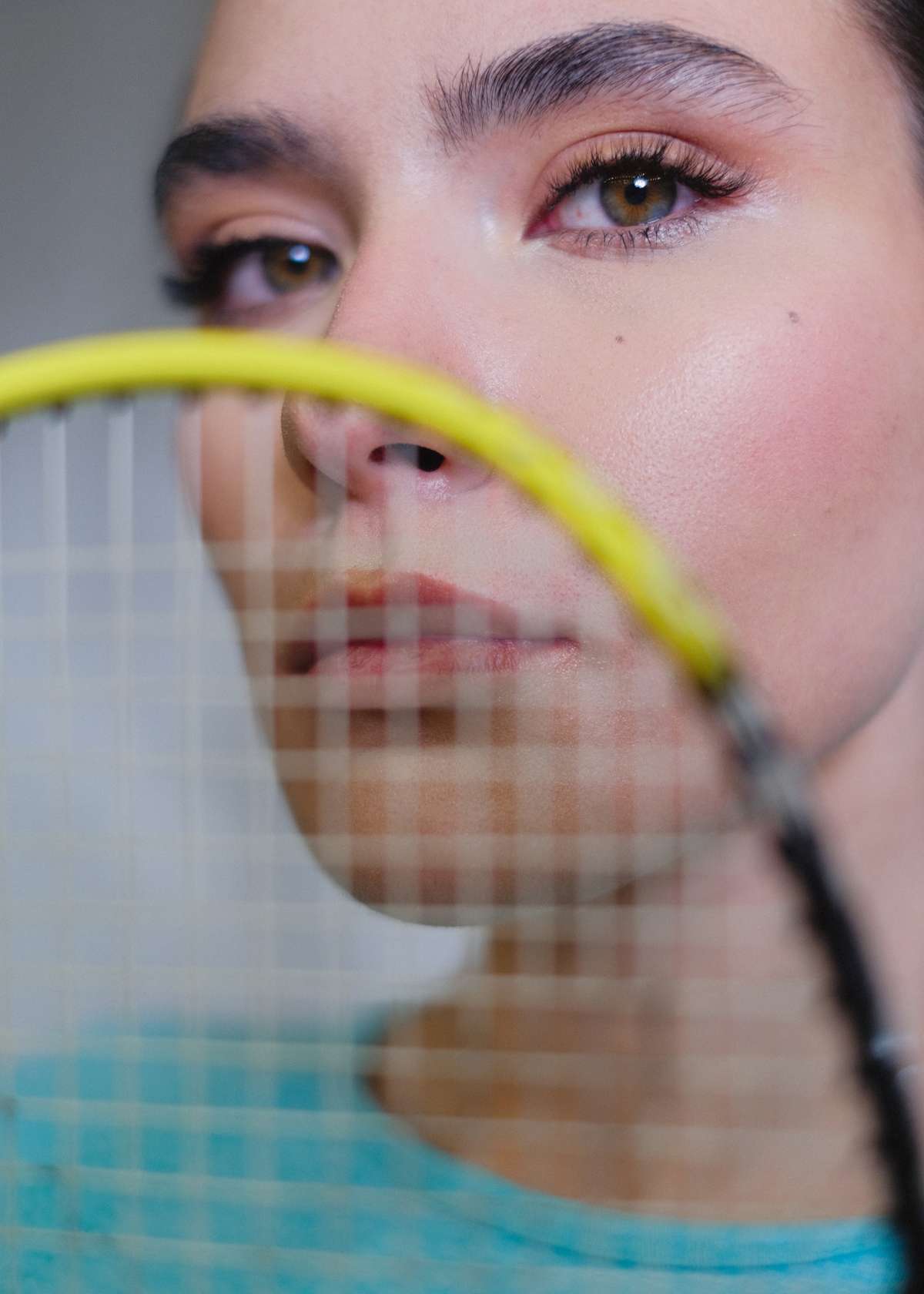 Female with badminton racquet